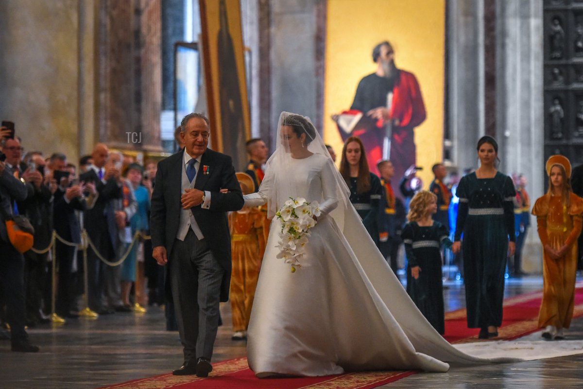 Victoria Romanovna Bettarini accompanied by her father, Roberto Bettarini arrive for her wedding ceremony at Saint Isaac's Cathedral in Saint Petersburg, on October 1, 2021
