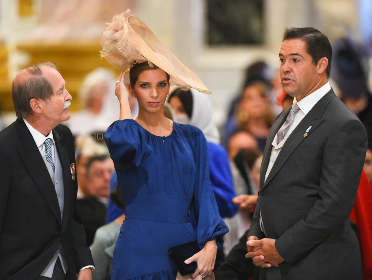 Duke of Braganza Duarte Pio (L) speaks with Princess Marie-Marguerite, Duchess of Anjou (C), and her husband Prince Louis Alphonse de Bourbon, Duke of Anjou (R), as they attend the wedding ceremony of Grand Duke George Mikhailovich Romanov and Victoria Romanovna Bettarini at Saint Isaac's Cathedral in Saint Petersburg, on October 1, 2021
