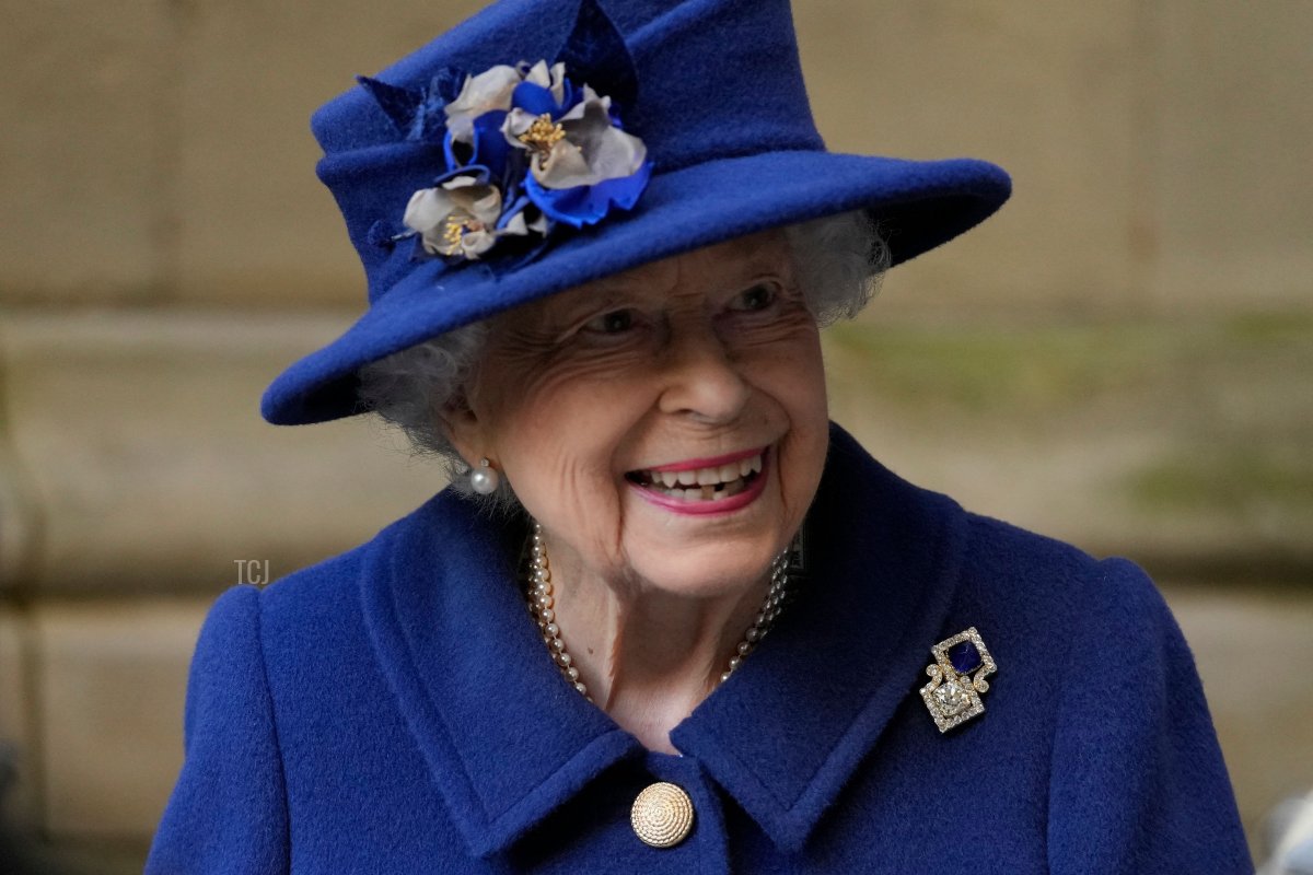 Britain's Queen Elizabeth II smiles as she leaves after attending a Service of Thanksgiving to mark the Centenary of the Royal British Legion at Westminster Abbey in London on October 12, 2021