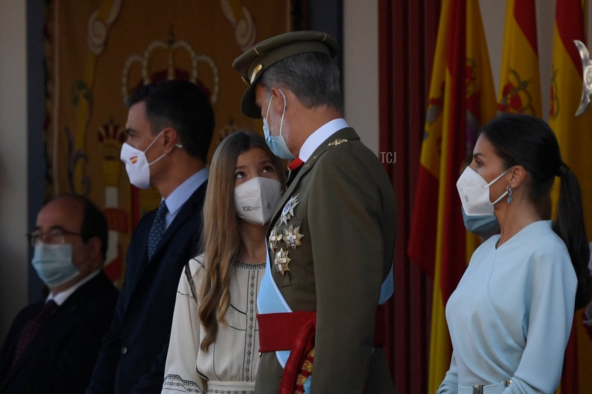 Queen Letizia of Spain (R), King Felipe VI of Spain (2ndR), Spanish Princess Sofia (C) and Spain's Prime Minister Pedro Sanchez, attend the Spanish National Day military parade in Madrid on October 12, 2021