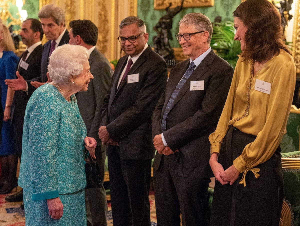 Britain's Queen Elizabeth II (L) greets guests including Microsoft founder-turned-philanthropist Bill Gates (2R) during a reception to mark the Global Investment Summit, at Windsor Castle in Windsor, west of London on October 19, 2021