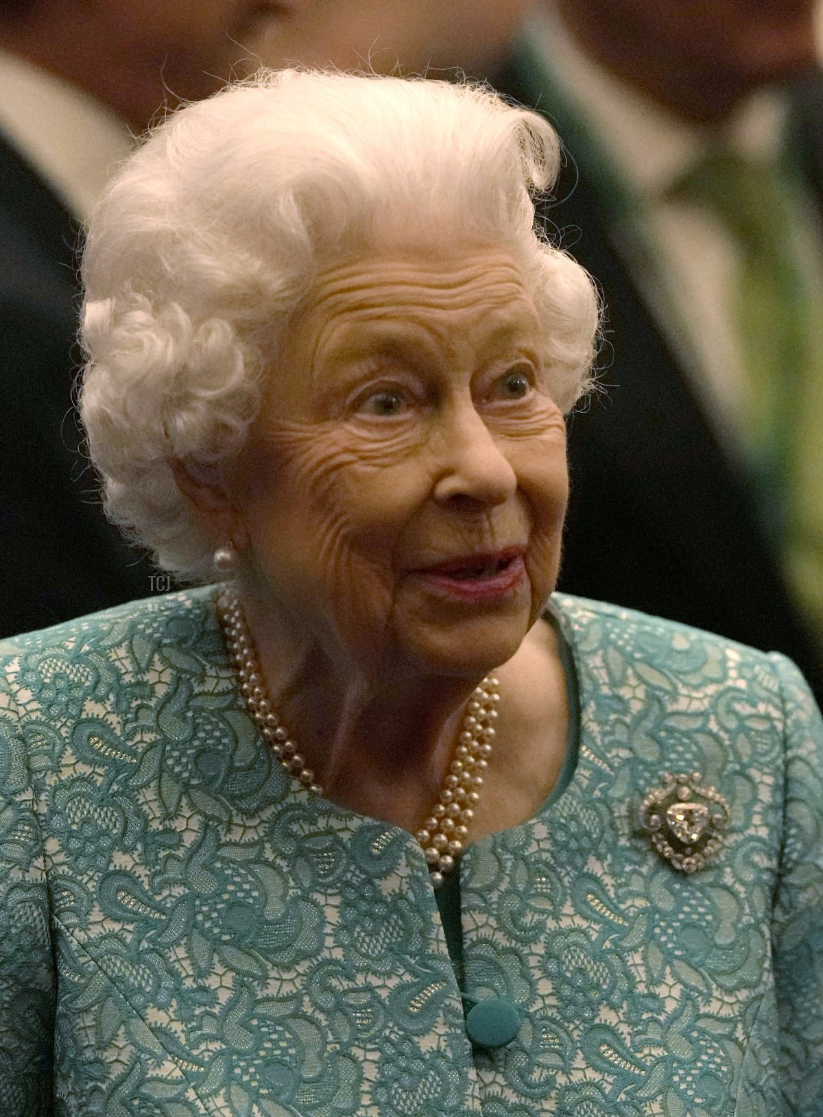Queen Elizabeth II and Prime Minister Boris Johnson (L) greet guests at a reception for the Global Investment Summit at Windsor Castle on October 19, 2021 in Windsor, England