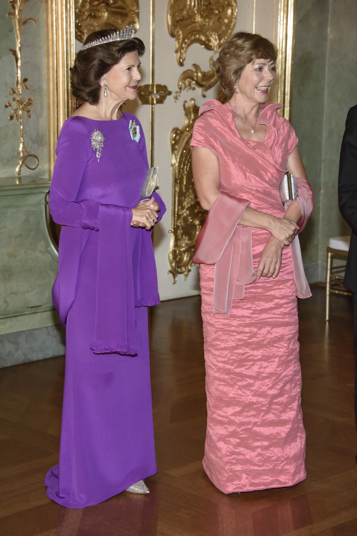 Queen Silvia (L) and the partner of German President Joachim Gauck, Daniela Schadt, attend a banquet at Charlottenburg Palace on October 6, 2016 in Berlin, Germany