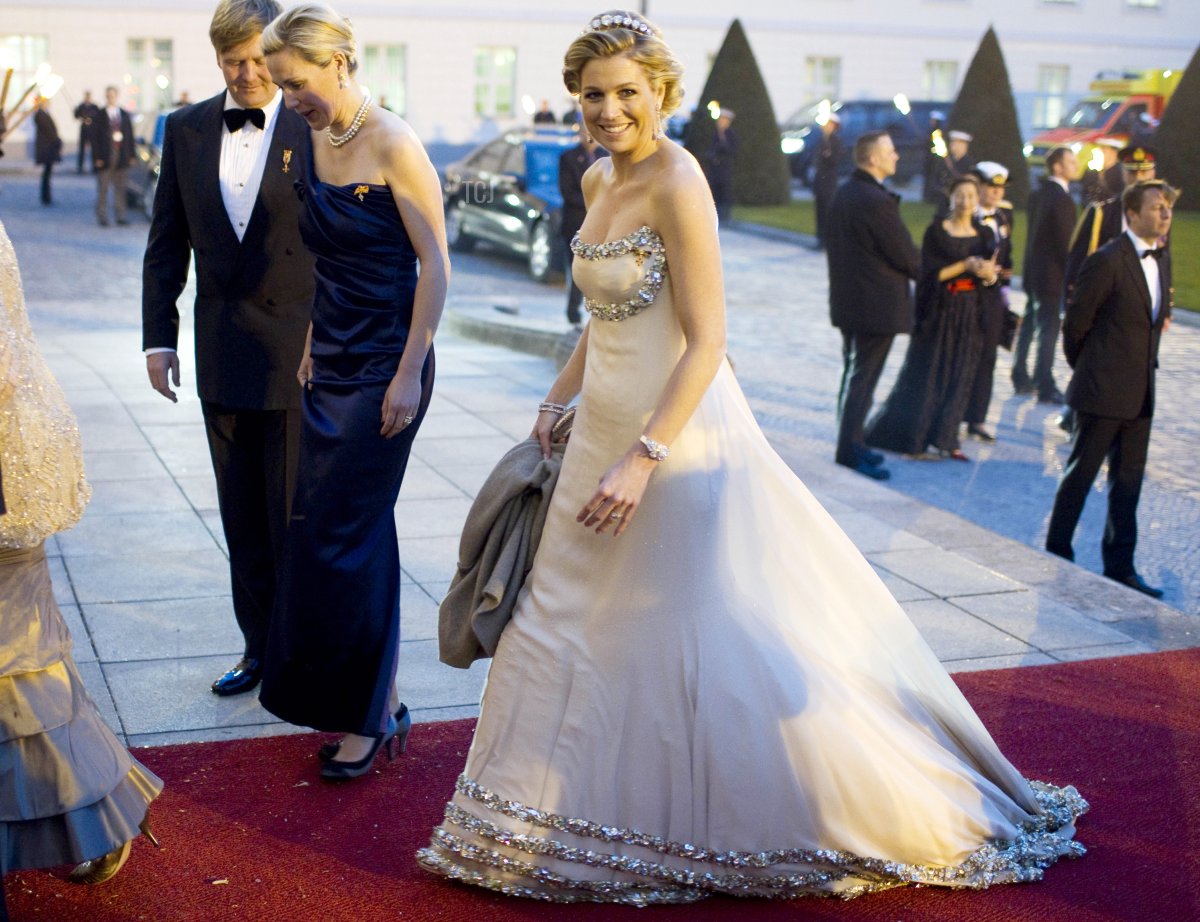 Crown Prince Willem-Alexander, Bettina Wulff, the wife of the German president and Princess Maxima, arrive for a state banquet at Bellevue Palace in Berlin, on April 12, 2011