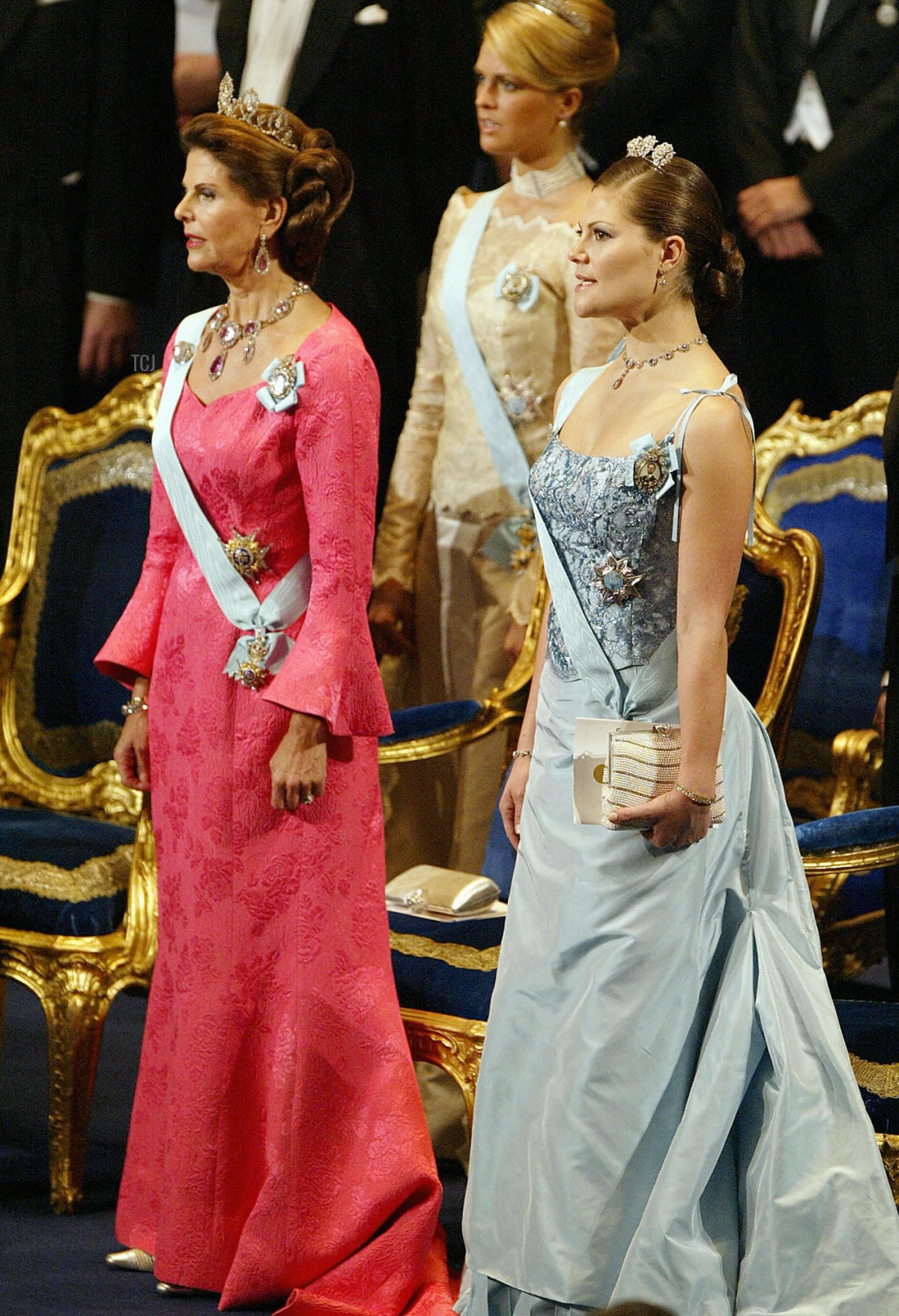 Sweden's Queen Silvia (L) sings the national anthem with her daughters Crown Princess Victoria and Princess Madeleine behind, as the Royal family attend the Nobel Prize Award ceremony in Stockholm, 10 December 2003