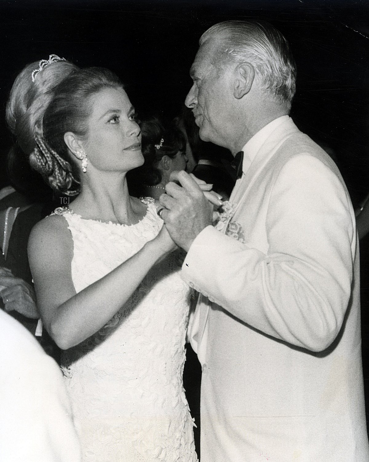 Princess Grace dances with Douglas Fairbanks Jr. at the Bal de Petit Lits Blancs in Monaco, July 1966