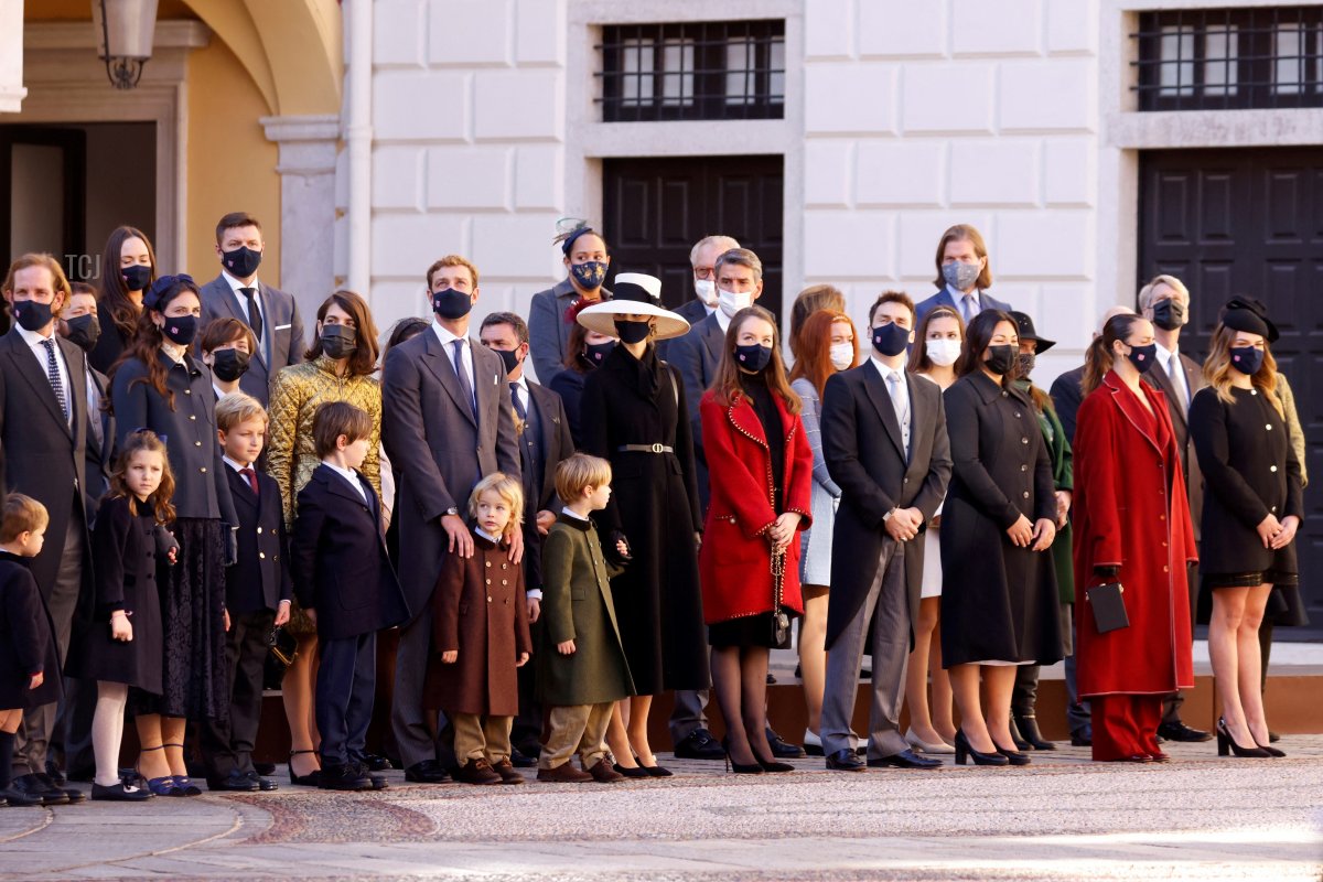 Members of Monaco's royal family Andrea Casiraghi (2nd row L), his wife Tatiana Santo Domingo (2nd row 2ndL), Pierre Casiraghi (2nd row 4thL) Beatrice Borromeo (C) and Alexandra of Hanover (in red) attend celebrations marking Monaco's National Day at the Palace in Monaco, November 19, 2021