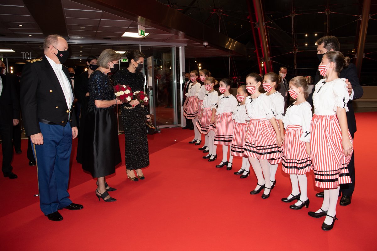 Prince Albert II of Monaco, Princess Caroline of Hanover and Charlotte Casiraghi greet children prior to a Gala at the Grimaldi Forum during the Monaco National Day Celebrations on November 19, 2021 in Monte-Carlo, Monaco