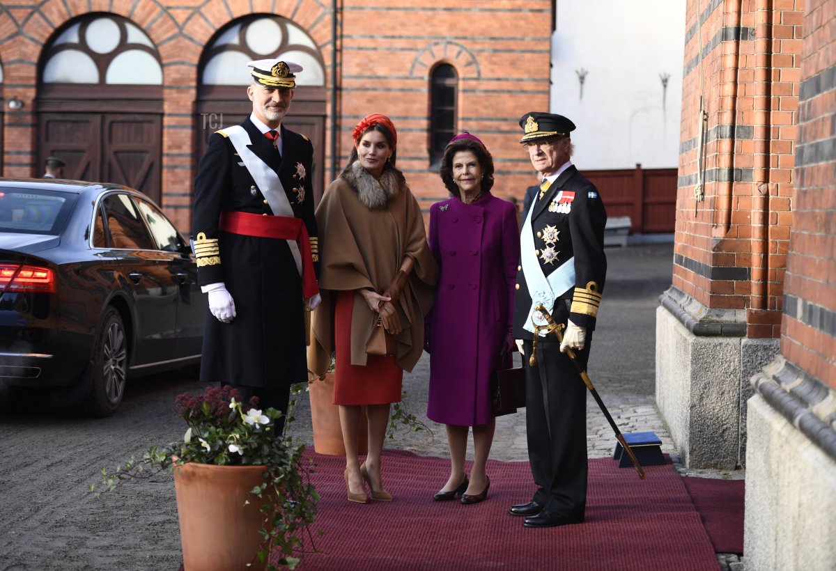 King Carl Gustaf of Sweden (R) and Queen Silvia of Sweden (2nd R) welcome King Felipe of Spain (L) and Queen Letizia of Spain at the Royal Stables, for the carriage procession to the Royal Palace, in Stockholm on November 24, 2021