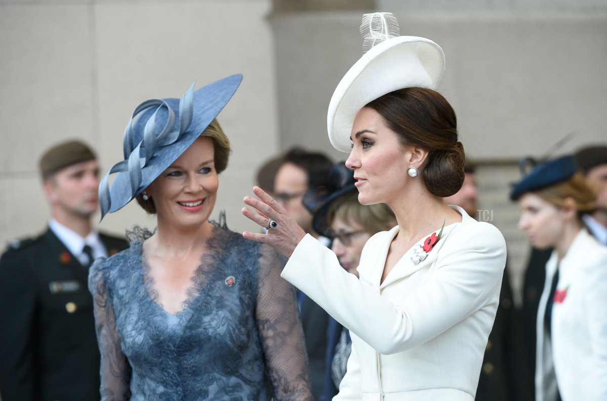 Queen Mathilde of Belgium (L) listens to Britain's Catherine, Duchess of Cambridge as they attend a ceremony marking the centenary of the battle of Passchendaele, one of the bloodiest of World War I during the Last Post ceremony at the Commonwealth War Graves Commission in Ypres (Menin Gate) Memorial, in Ypres Western Flanders on July 30, 2017