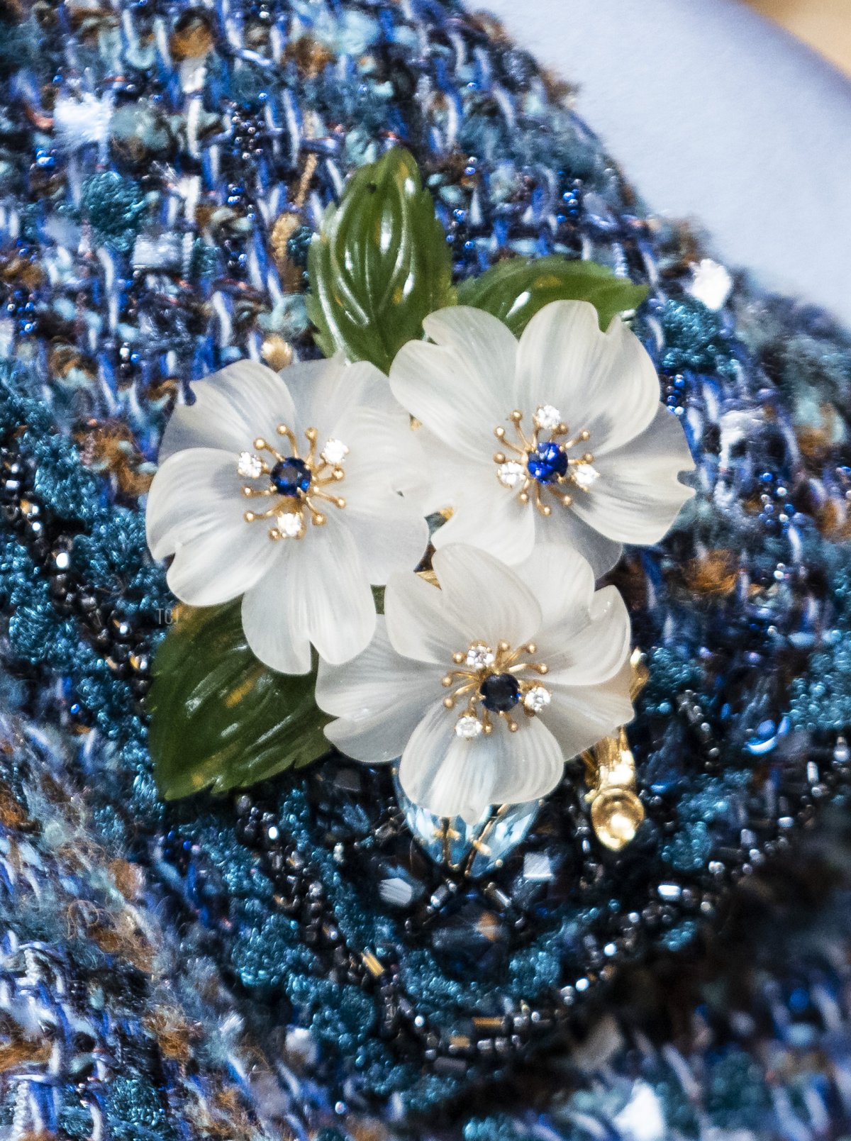 Queen Silvia, brooch detail, is seen during a tour of the Bernadotte Library by Queen Silvia of Sweden during an official state visit at the Stockholm Palace on November 25, 2021 in Stockholm, Sweden
