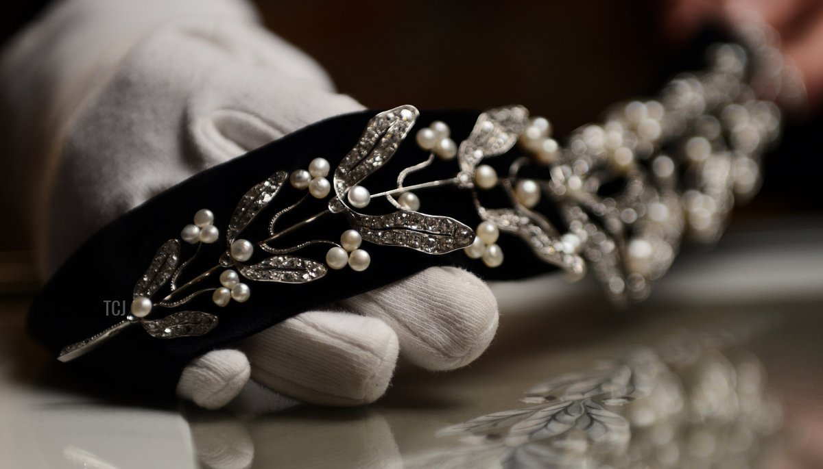 A picture taken on December 18, 2012 shows a 1910 wedding tiara with branches of mistletoe, pearls, diamonds and platinum, displayed in the Mellerio jewelry store in Paris