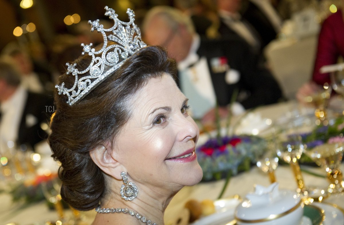 Swedish Queen Silvia sits at the honorary table of Nobel banquet following the 2011 Nobel Prize award Ceremony at Stockholm Town Hall on December 10, 2011