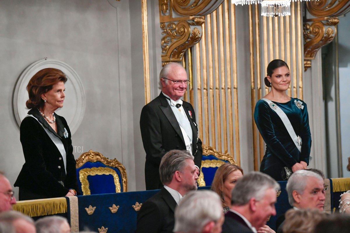Queen Silvia, King Carl XVI Gustaf, and Crown Princess Victoria of Sweden attend the Swedish Academy's Annual Grand Ceremony at the Old Stock Exchange building in Stockholm, Sweden, 20 Dec 2021
