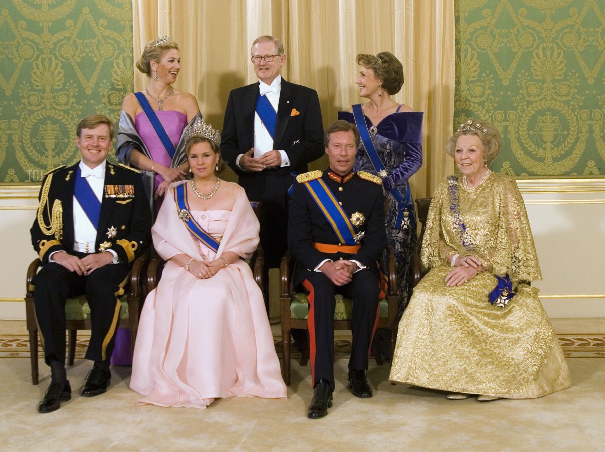 The Grand Duke Henri of Luxemburg (2ndR) and his wife Maria Teresa (2nd L) pose with Dutch Queen Beatrix (R), Dutch Crown Prince Willem Alexander (L), Dutch Princess Maxima (rear L), Pieter van Vollenhove (rear C) and Princess Margriet for a group photo at the Noordeinde Palace in The Hague, the Netherlands April 24, 2006