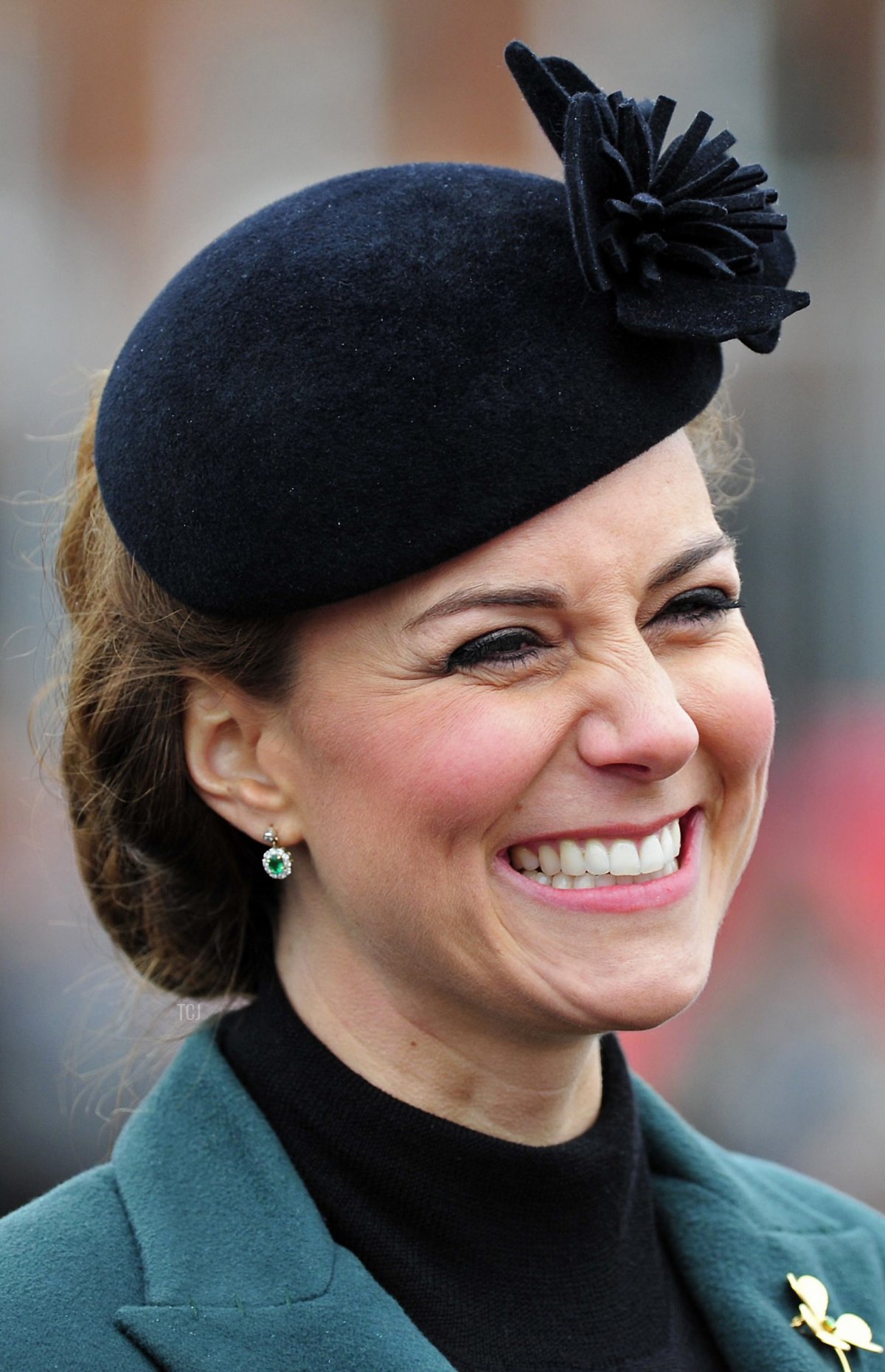 Britain's Catherine, Duchess of Cambridge, smiles during a visit with her husband, Prince William, to attend a St Patrick's Day Parade at Mons Barracks in Aldershot, southern England, on March 17, 2013