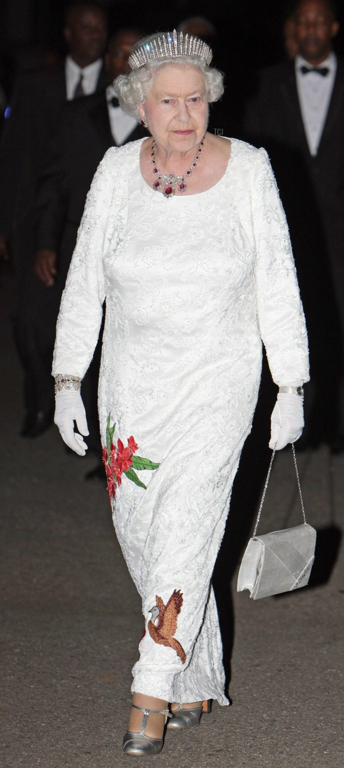 Queen Elizabeth II, walks in the grounds of President George Maxwell Richards' official Home in the Port of Spain, Trinidad before joining guests at a State Dinner, 26 Nov 2009