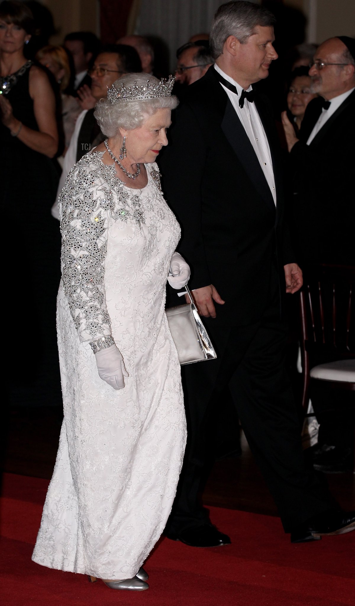 Queen Elizabeth II and Canadian Prime Minister Stephen Harper arrive at a dinner at the Royal York Hotel on July 5, 2010 in Toronto, Canada