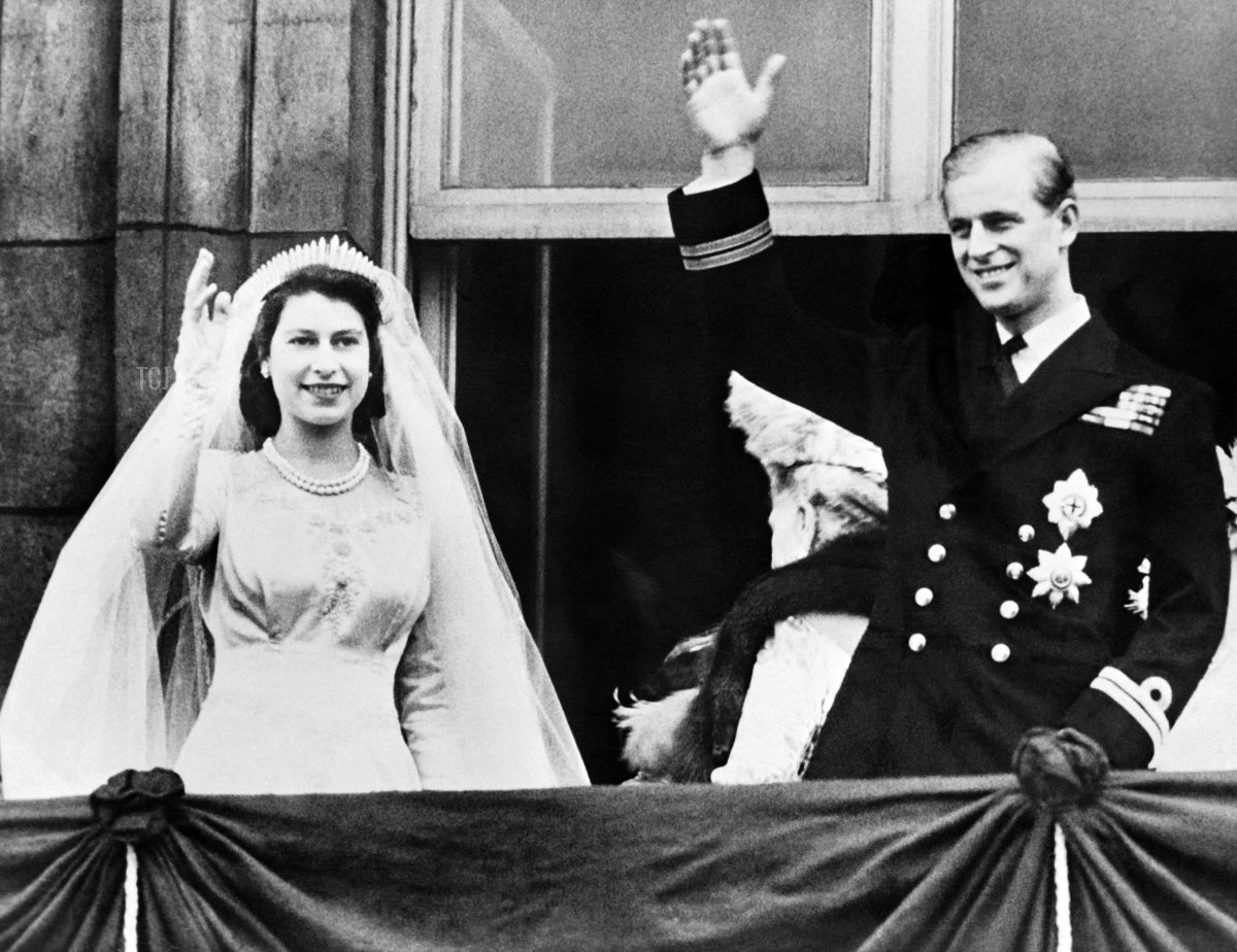 Queen Elizabeth II and Prince Philip, Duke of Edinburgh wave at their wedding, on November 20, 1947, in London