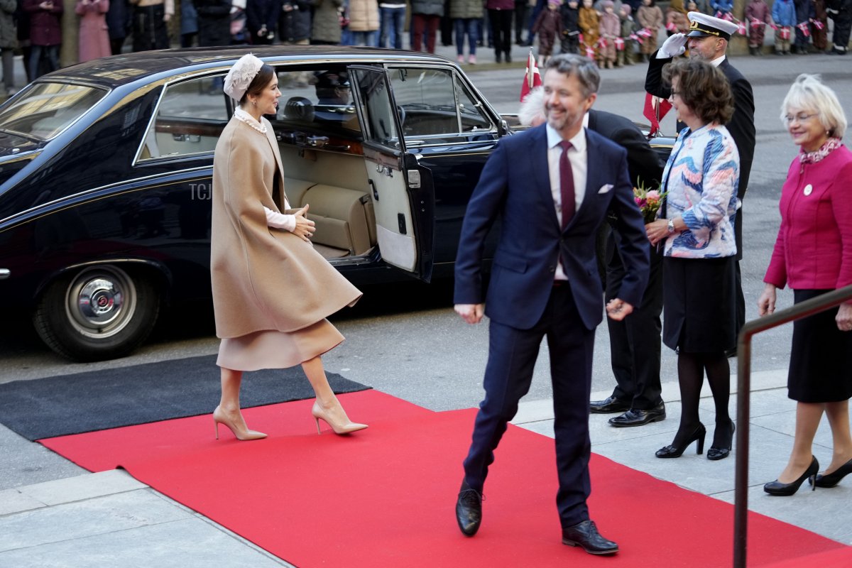 Crown Princes Mary of Denmark (L) and Crown Prince Frederik of Denmark arrive to participate in the Danish Parliament's celebration of the 50th Regent's Anniversary of Queen Margrethe II of Denmark (not in picture) at Christiansborg Caste in Copenhagen on January 14, 2022