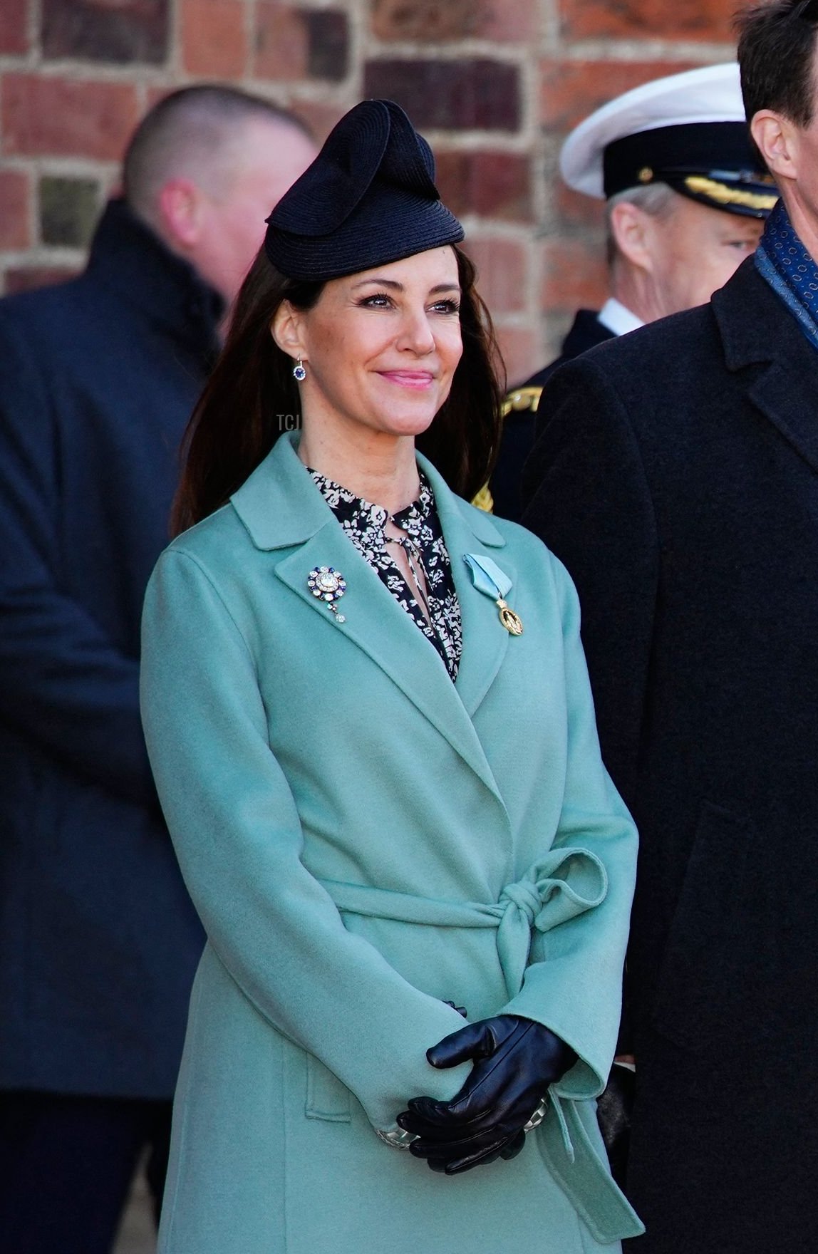 Queen Margrethe II of Denmark (front) speaks to (LtoR) Princess Marie of Denmark, Prince Joachim of Denmark, Crown Princess Mary of Denmark and Crown Prince Frederik of Denmark after visiting the tomb of her father, Frederick IX of Denmark, at Roskilde Cathedral on the day of Queen's 50th anniversary of her accession to the throne, in Roskilde, Denmark, on January 14, 2022