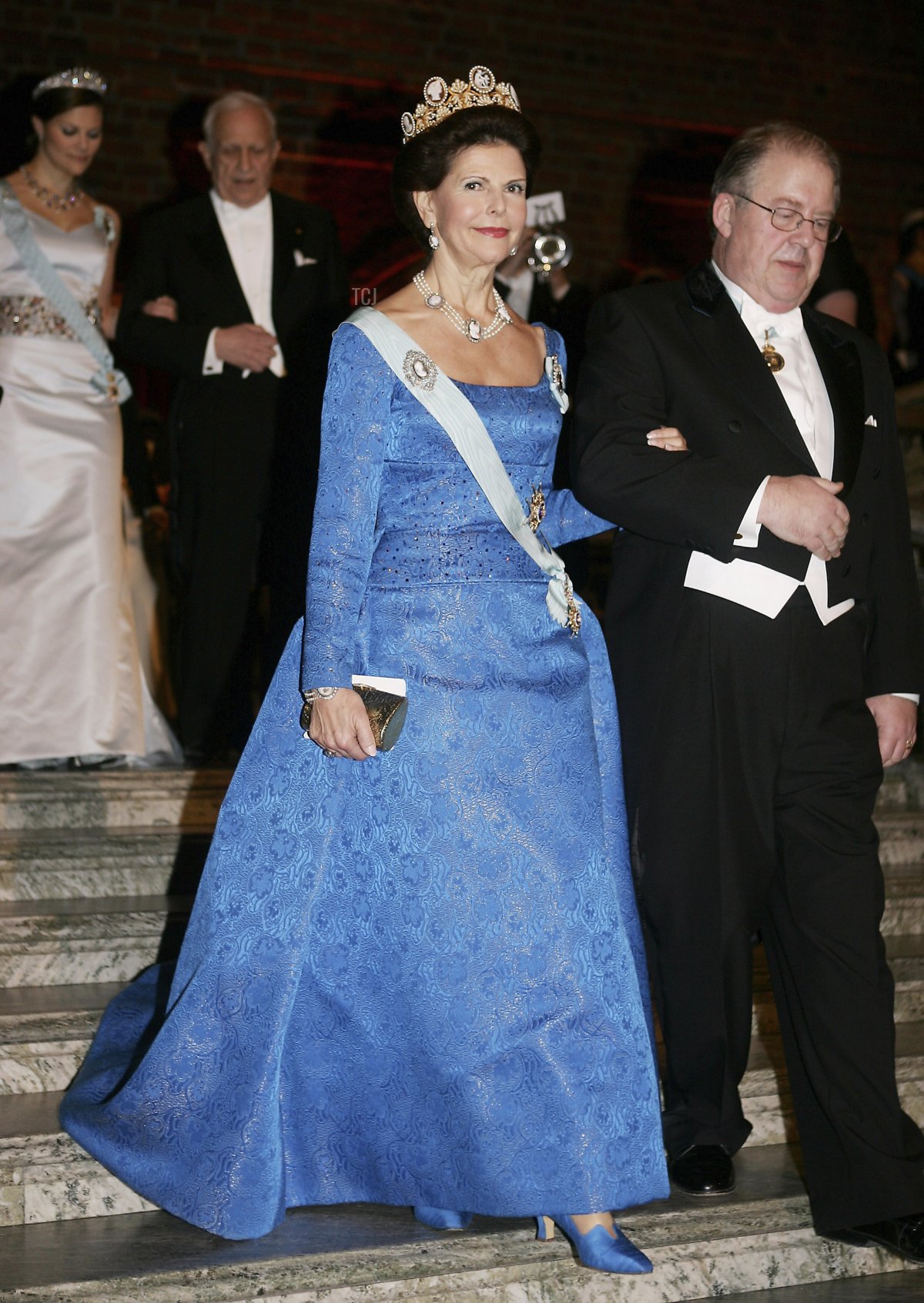 Queen Silvia of Sweden and guest arrive at the Nobel Banquet held at the City Hall on December 10, 2005 in Stockholm, Sweden