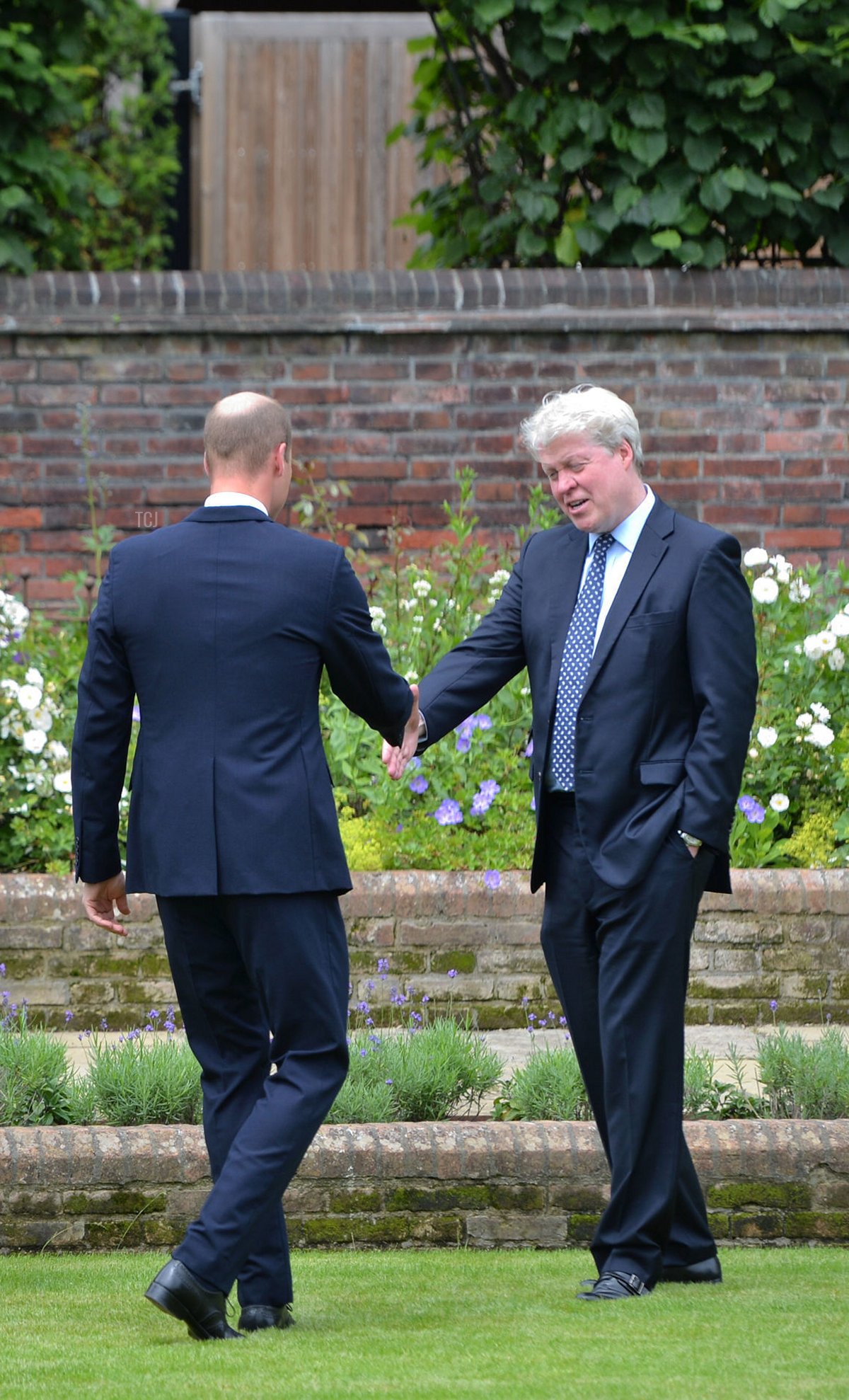 Prince Harry, Duke of Sussex and Prince William, Duke of Cambridge greet Lady Sarah McCorquodale, Lady Jane Fellowes and Earl Spencer prior the Unveiling of a statue of Princess of Wales, in the Sunken Garden at Kensington Palace, on what would have been her 60th birthday on July 1, 2021 in London, England