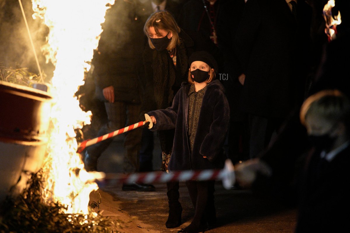 Princess Caroline of Hanover (L) and Princess Gabriella set alight a sailboat during the Sainte Devote festivities, in Monaco on January 26, 2022