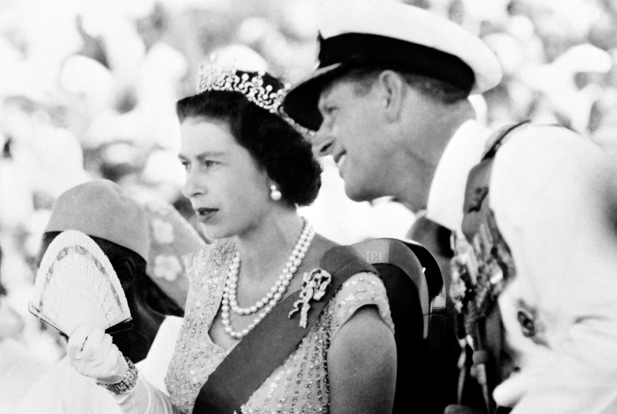 Britain's Queen Elizabeth II and Prince Philip, Duke of Edinburgh, watch on December 4, 1961 the Susu dancers as they visit the Northern Province of Sierra Leone