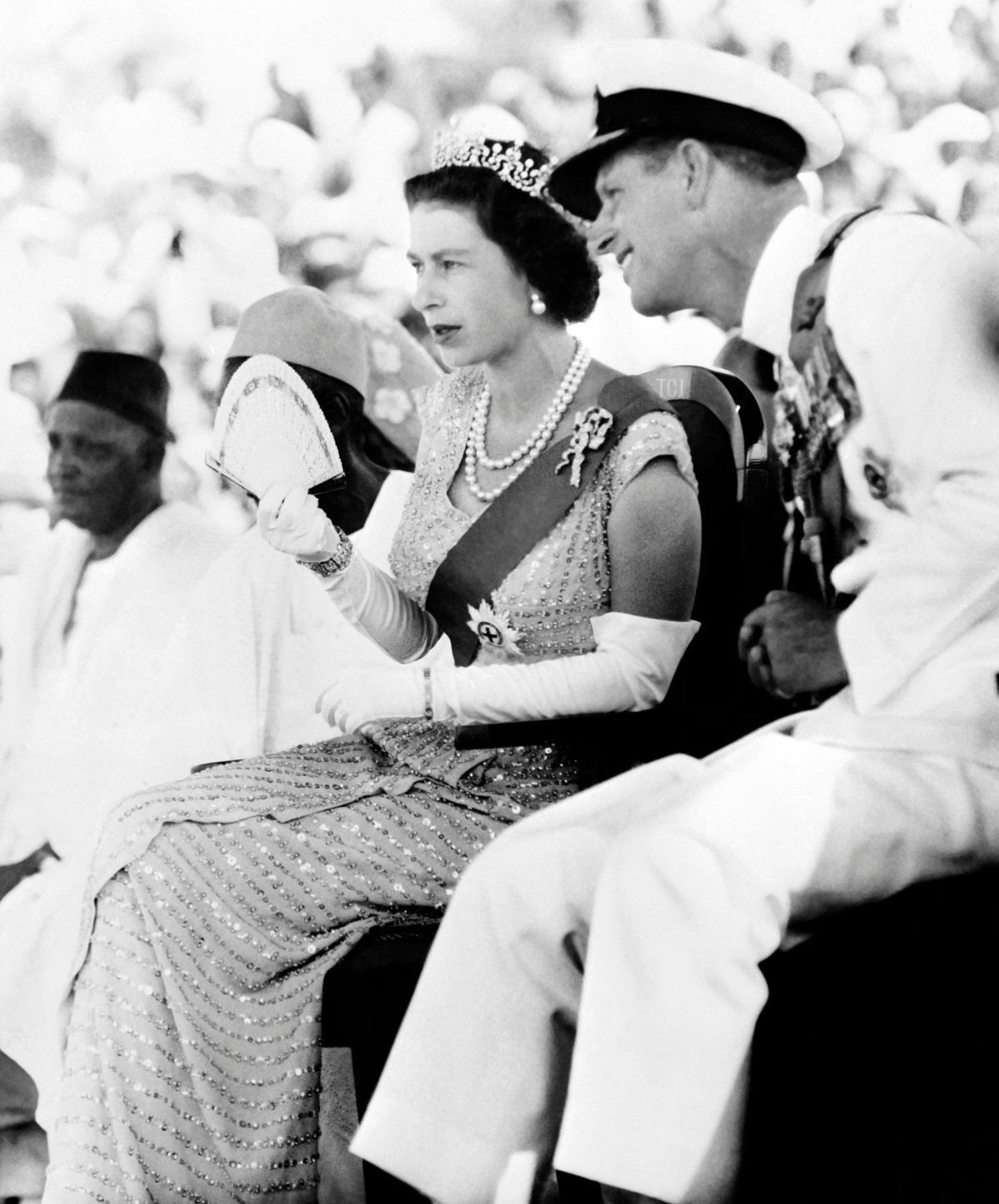 Britain's Queen Elizabeth II and Prince Philip, Duke of Edinburgh, watch on December 4, 1961 the Susu dancers as they visit the Northern Province of Sierra Leone