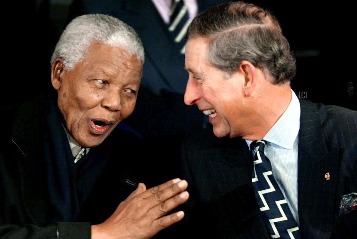 Former South African President Nelson Mandela (L) with Britain's Prince Charles at the People's Party held at Amsterdam Aren, 01 February 2002