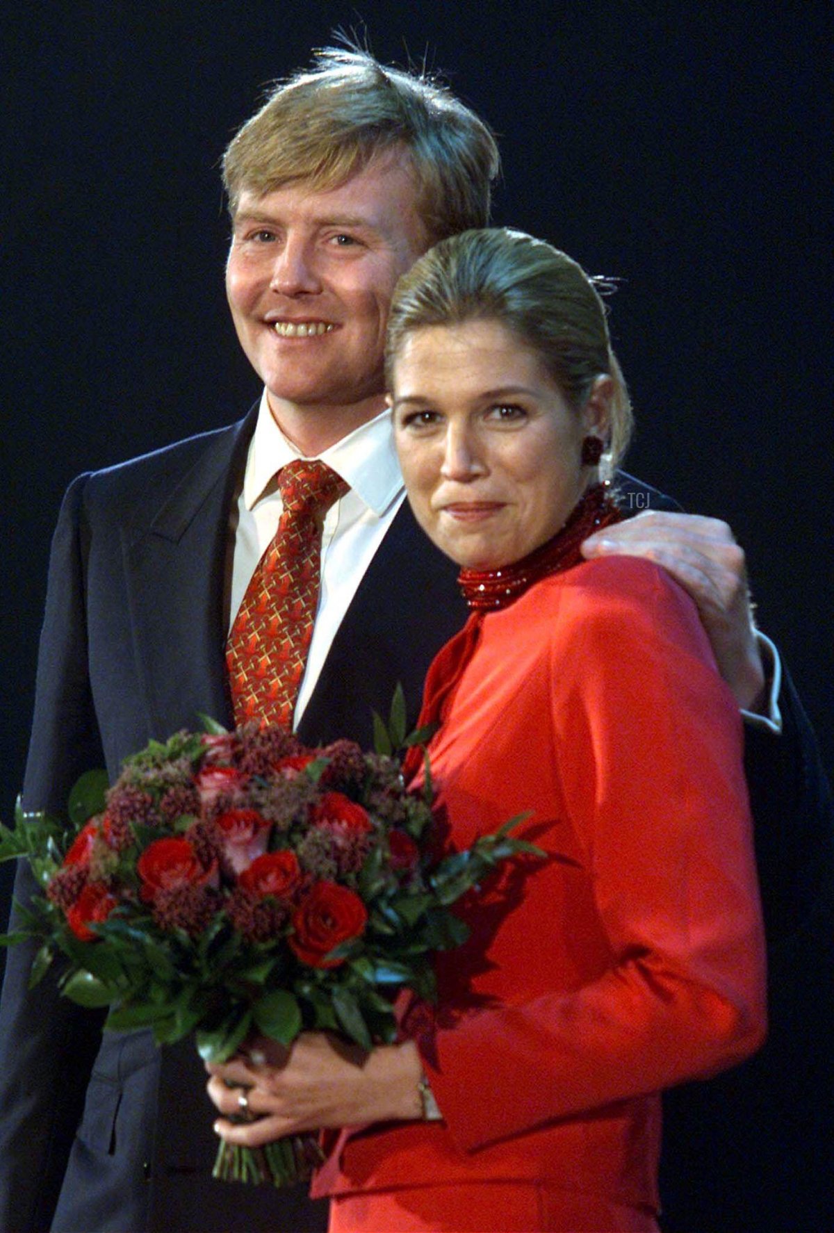 Dutch Crown Prince Willem-Alexander (L) and his fiancee Maxima Zorreguieta, of Argentina smile when being presented with the gift of the Dutch people at Amsterdam's Arena stadium Friday February 1, 2002