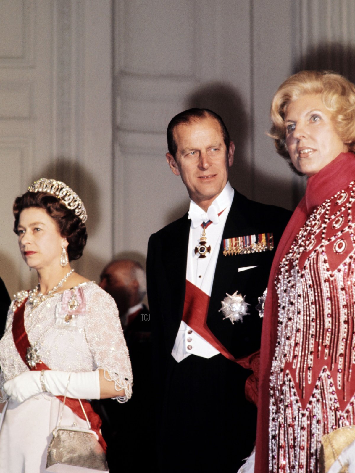 Queen Elizabeth II, the Duke of Edinburgh, and French First Lady Claude Pompidou arrive for a state dinner at the Grand Trianon in Versailles on May 16, 1972 (AFP via Getty Images)