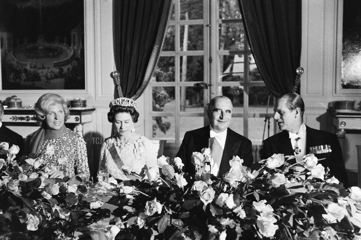 Queen Elizabeth II (2-L) and Prince Philip, Duke of Edinburgh (R) flanked by French President Georges Pompidou (2-R) and his wife Claude (L) attend a state dinner at the Grand Trianon in Versailles on May 15, 1972