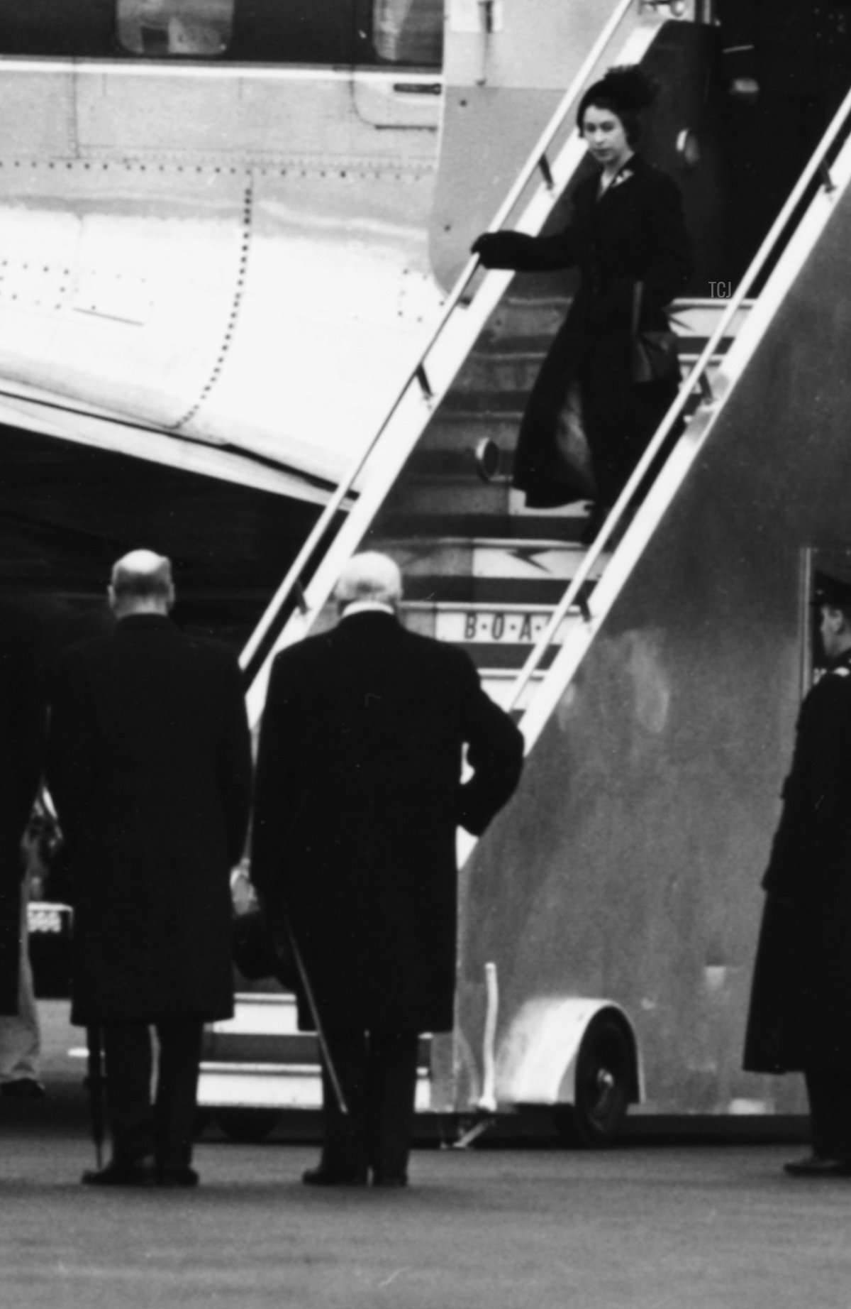 Queen Elizabeth II and Prince Philip, the Duke of Edinburgh, leaving their BOAC airliner as they return from Kenya following the death of King George VI and Elizabeth's accession to the throne, London, February 7th 1952
