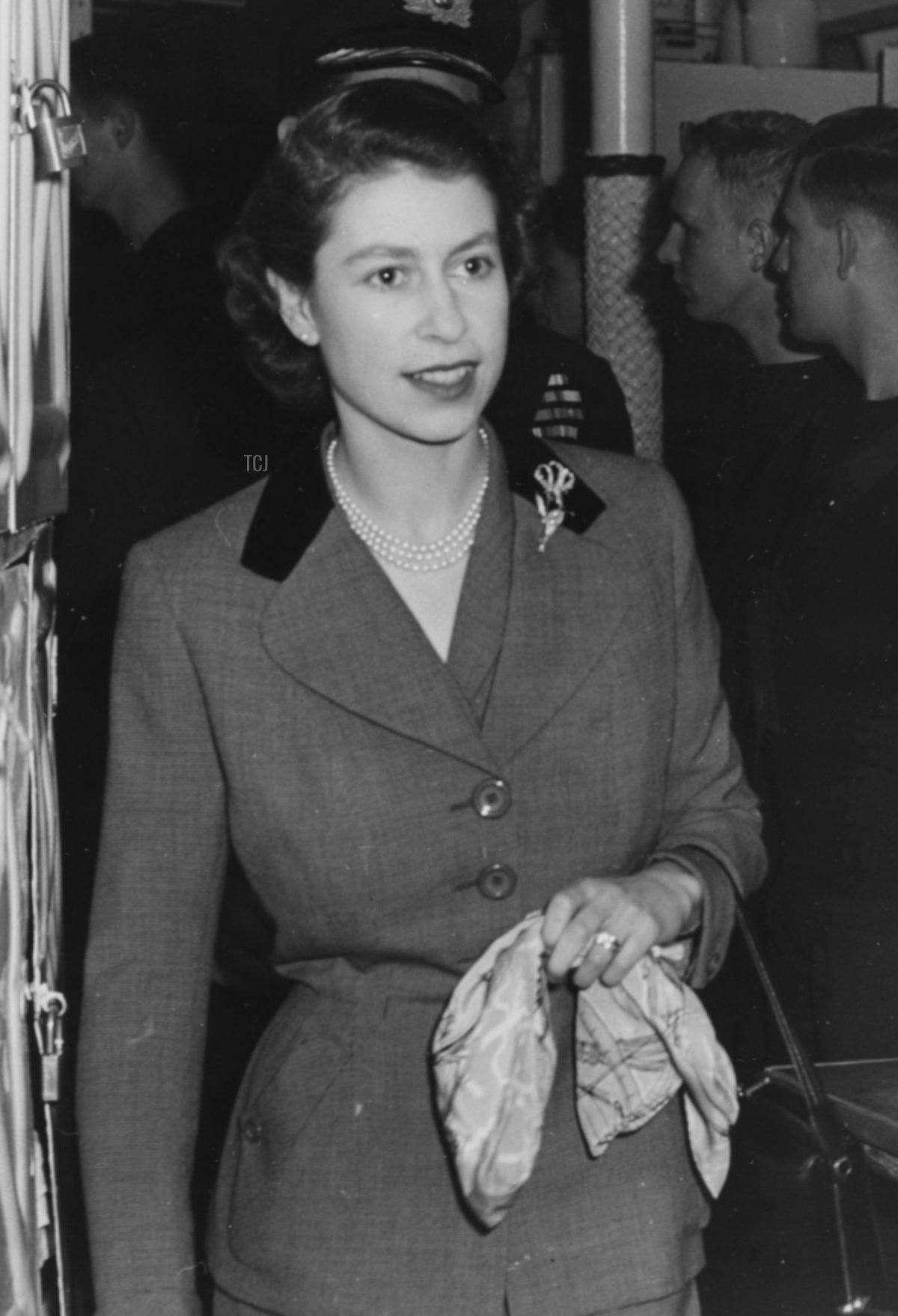 Princess Elizabeth inspecting a group of crewmen aboard the HMCS Ontario, during a Royal tour in Newfoundland, November 15th 1951