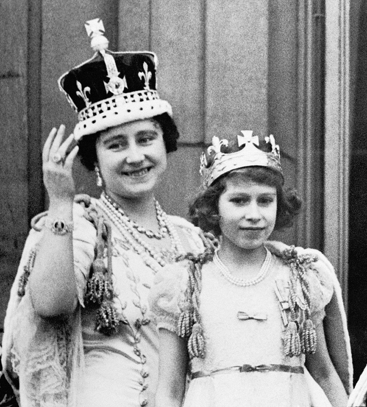 Queen Elizabeth (the Queen Mother) is with her eldest daughter Princess Elizabeth (the Queen) on the balcony of Buckingham Palace, after the coronation of King George VI