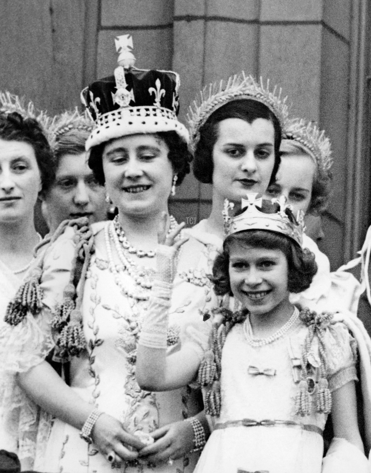 Queen Elizabeth (the Queen Mother) is with her eldest daughter Princess Elizabeth (the Queen) on the balcony of Buckingham Palace, after the coronation of King George VI