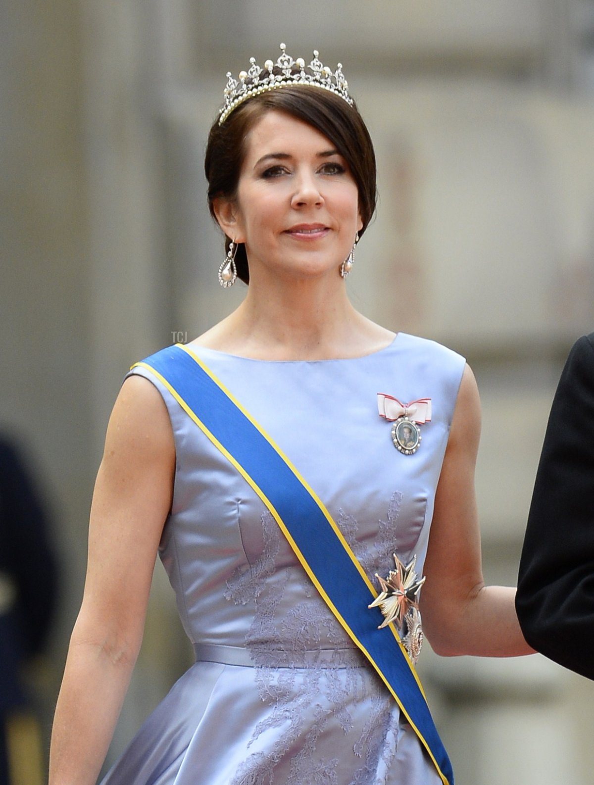 Crown Princess Mary of Denmark (L) and Crown Prince Frederik of Denmark arrive for the wedding of Sweden's Crown Prince Carl Philip and Sofia Hellqvist at Stockholm Palace on June 13, 2015