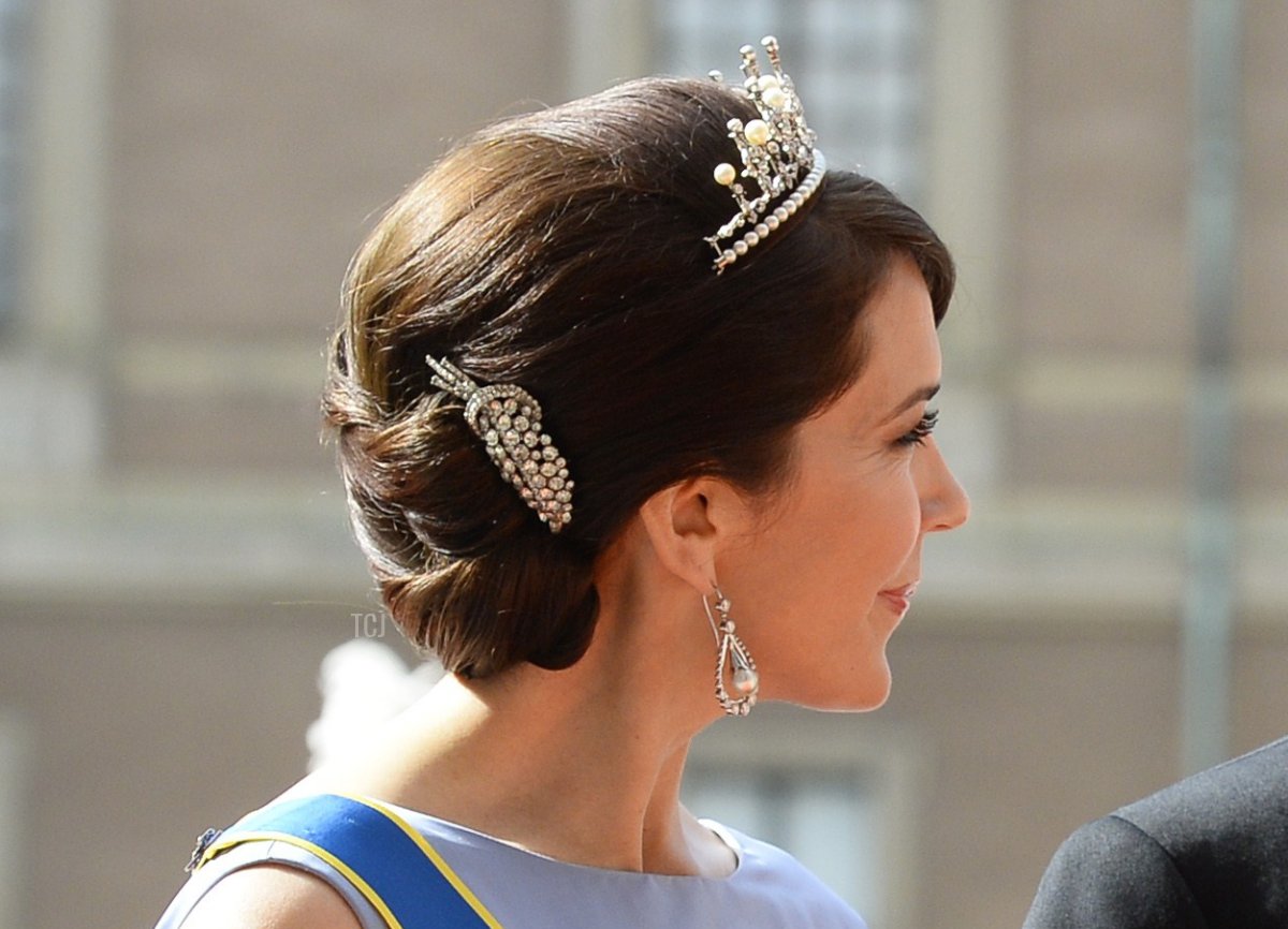 Crown Princess Mary of Denmark (L) and Crown Prince Frederik of Denmark arrive for the wedding of Sweden's Crown Prince Carl Philip and Sofia Hellqvist at Stockholm Palace on June 13, 2015