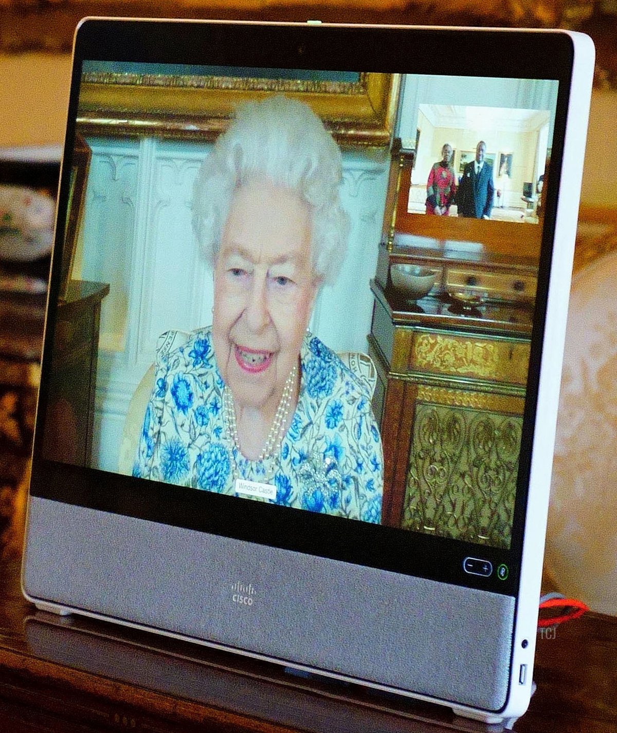 Britain's Queen Elizabeth II appears on a screen via videolink from Windsor Castle, during a virtual audience to receive the High Commissioner of Malawi, Dr. Thomas Bisika (not pictured), at Buckingham Palace in London on March 3, 2022