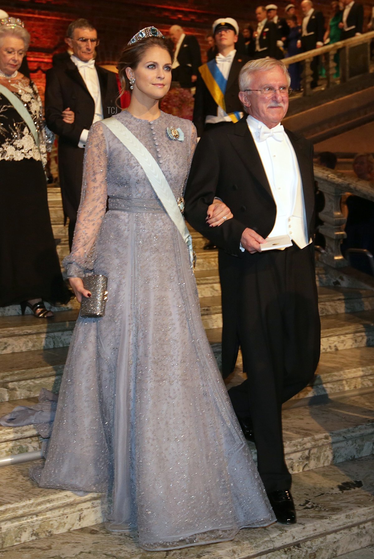 Sweden's Princess Madeleine (L) and Nobel Chemistry Prize 2015 co-winner US Paul Modrich arrive for the 2015 Nobel Banquet at the Stockholm City Hall on December 10, 2015