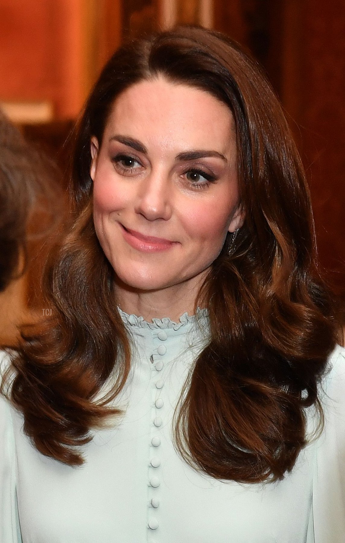 Britain's Catherine, Duchess of Cambridge (C), talks with guests as she attends a reception to mark the 50th Anniversary of the investiture of The Prince of Wales at Buckingham Palace in London on March 5, 2019