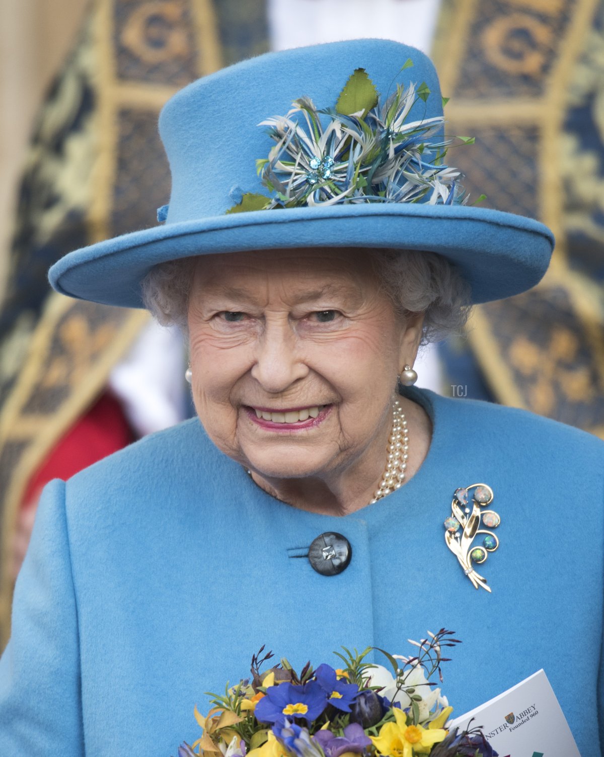 Queen Elizabeth II smiles as she leaves the annual Commonwealth Day service on Commonwealth Day on March 14, 2016 in Westminster Abbey, London