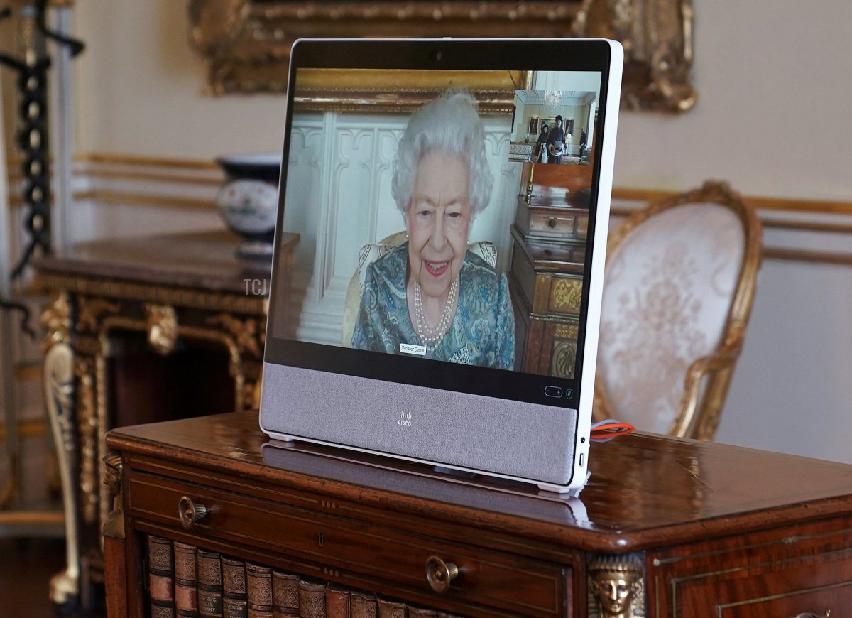 Queen Elizabeth II appears on a screen via videolink from Windsor Castle, where she is in residence, during a virtual audience to receive His Excellency Enkhsukh Battumur, Ambassador of Mongolia, and his wife Ganchimeg Purevdorj at Buckingham Palace on March 15, 2022 in London, England