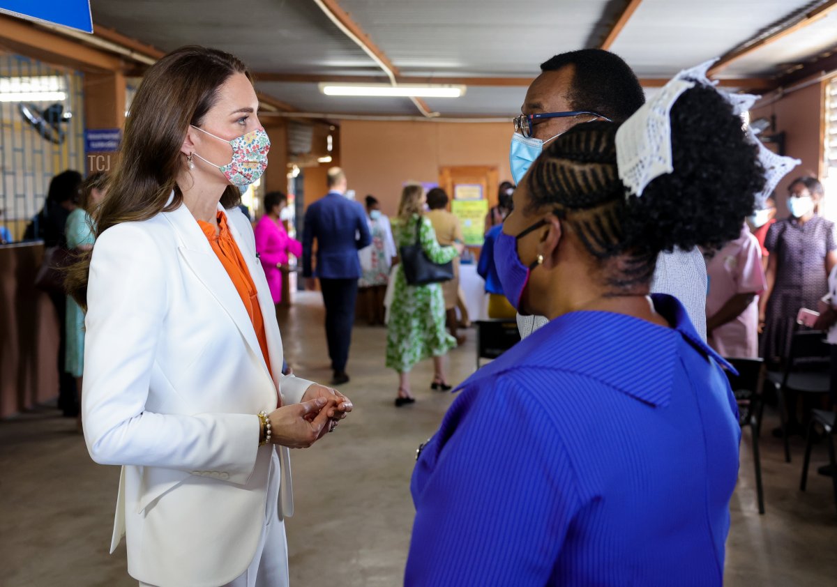 Catherine, Duchess of Cambridge speaks with staff during a visit to Spanish Town Hospital on March 23, 2022 in Spanish Town, Jamaica