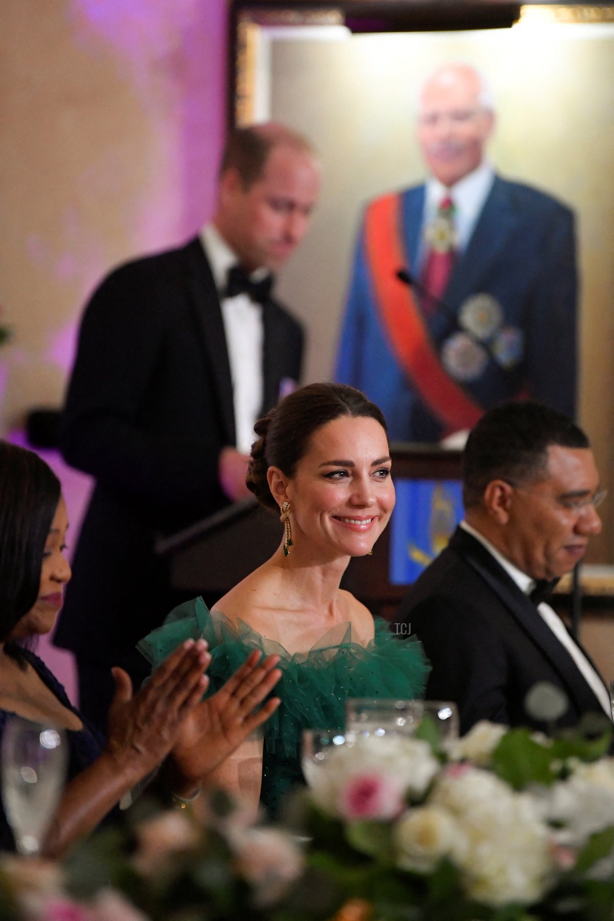 Catherine Duchess of Cambridge and Prime Minister of Jamaica Andrew Holness (R) listen as Prince William, Duke of Cambridge speaks during a dinner hosted by the Governor General of Jamaica at King's House on March 23, 2022 in Kingston, Jamaica