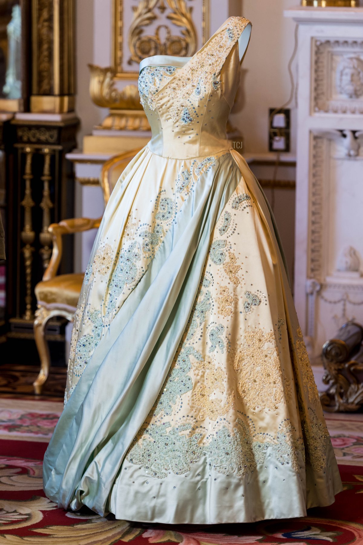 A general view of a pale blue and gold evening dress by Sir Norman Hartnell, worn by the Queen on a state visit to The Netherlands in 1958 during the press preview of 'Fashioning A Reign: 90 years Of Style From The Queen's Wardrobe' at Buckingham Palace on July 4, 2016 in London, England