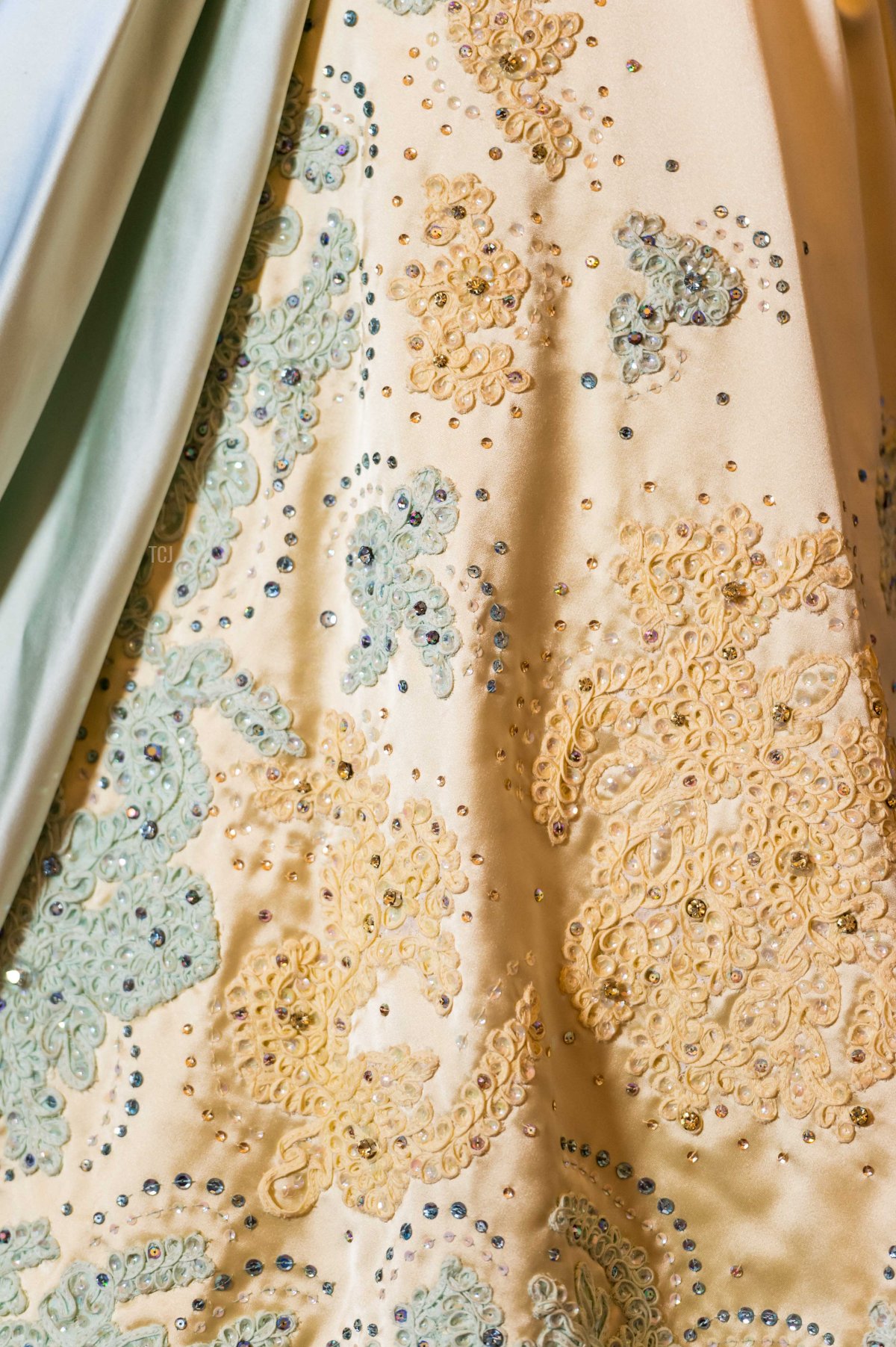 Detail of a pale blue and gold evening dress by Sir Norman Hartnell, worn by the Queen on a state visit to The Netherlands in 1958 during the press preview of 'Fashioning A Reign: 90 years Of Style From The Queen's Wardrobe' at Buckingham Palace on July 4, 2016 in London, England