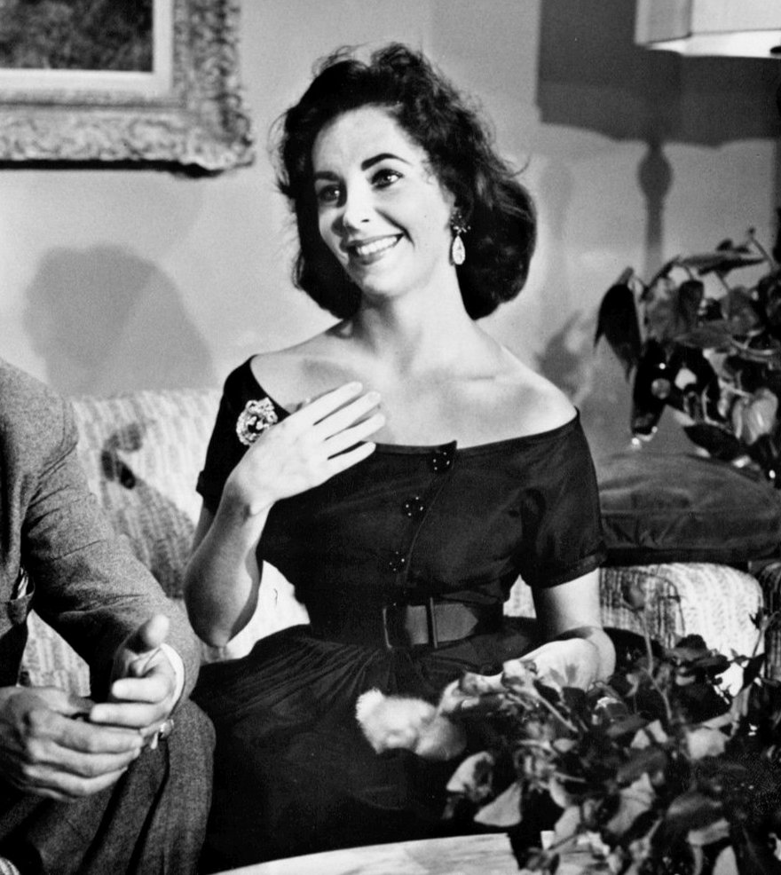 Photo of Mike Todd and Elizabeth Taylor from the anniversary party for the film Around the World in 80 Days. CBS paid Mike Todd for the rights to cover the birthday celebration as a live television special. He and Taylor are seen at home in a film clip used for the coverage